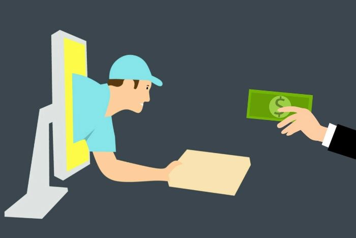 a delivery guy delivering a box and taking money